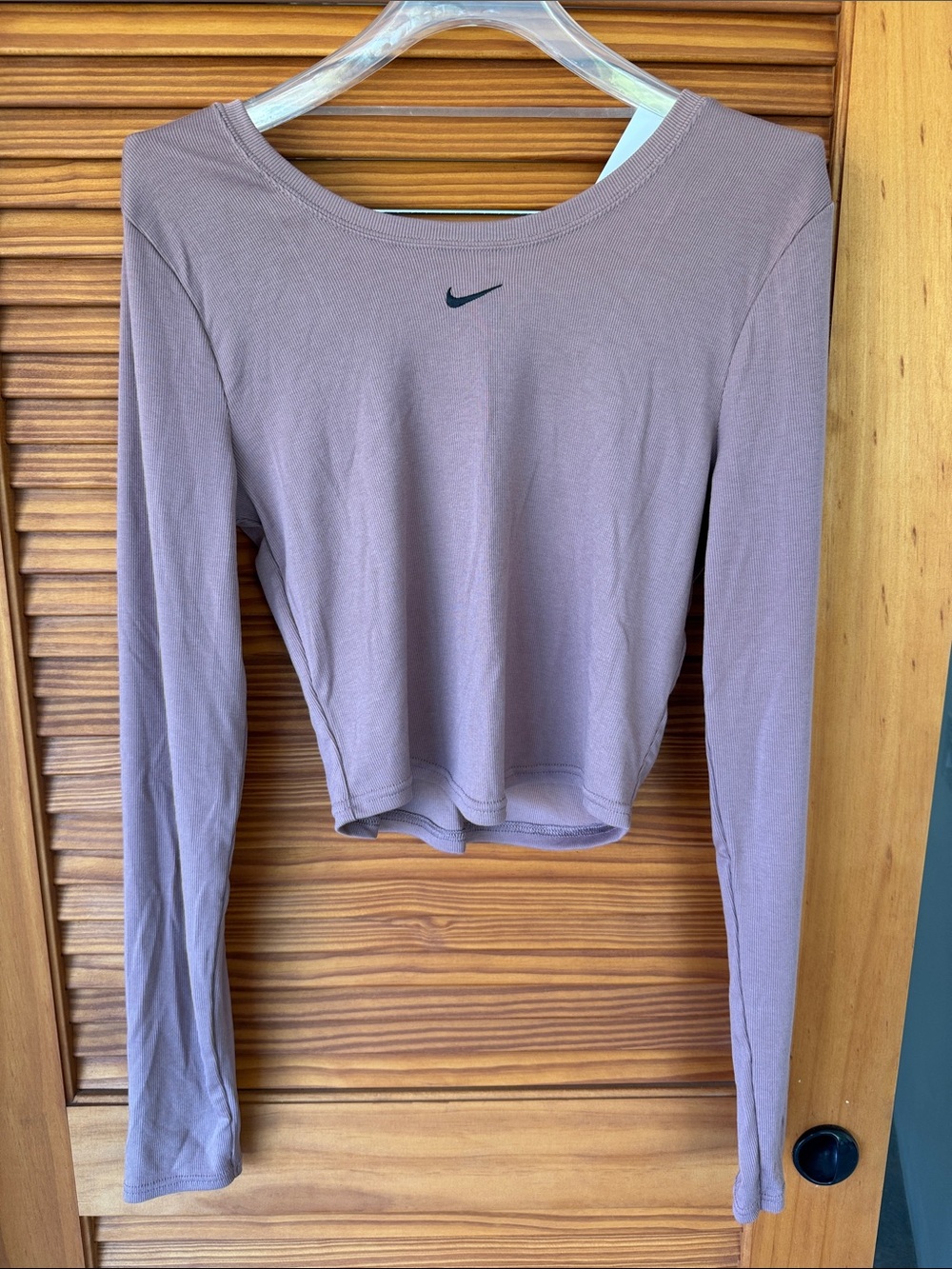 NIKE Women's Light Brown Cropped Long-Sleeve Top with Black Swoosh